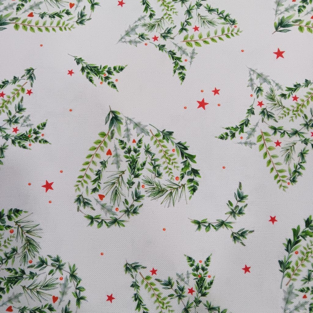 El tejido de mantelería resinada con estampado de Navidad es impermeable y resistente a las manchas.