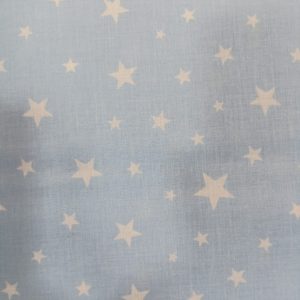 Algodón 100% en fondo celeste estampadas encontramos unas estrellas blancas