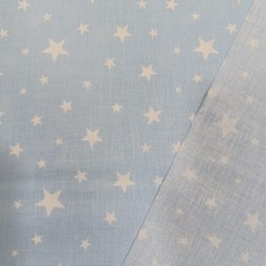 Algodón 100% en fondo celeste estampadas encontramos unas estrellas blancas