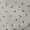 Tela de algodón 100% con estampado de de limones sobre fondo blanco