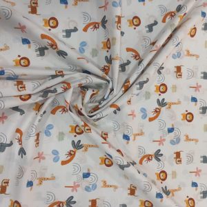 Algodón 100% tejido con fondo blanco y estampados encontramos unos divertidos animalitos, leones,jirafas,llamas,monitos,cacatuas.... rodeados de arcoiris y palmeras.