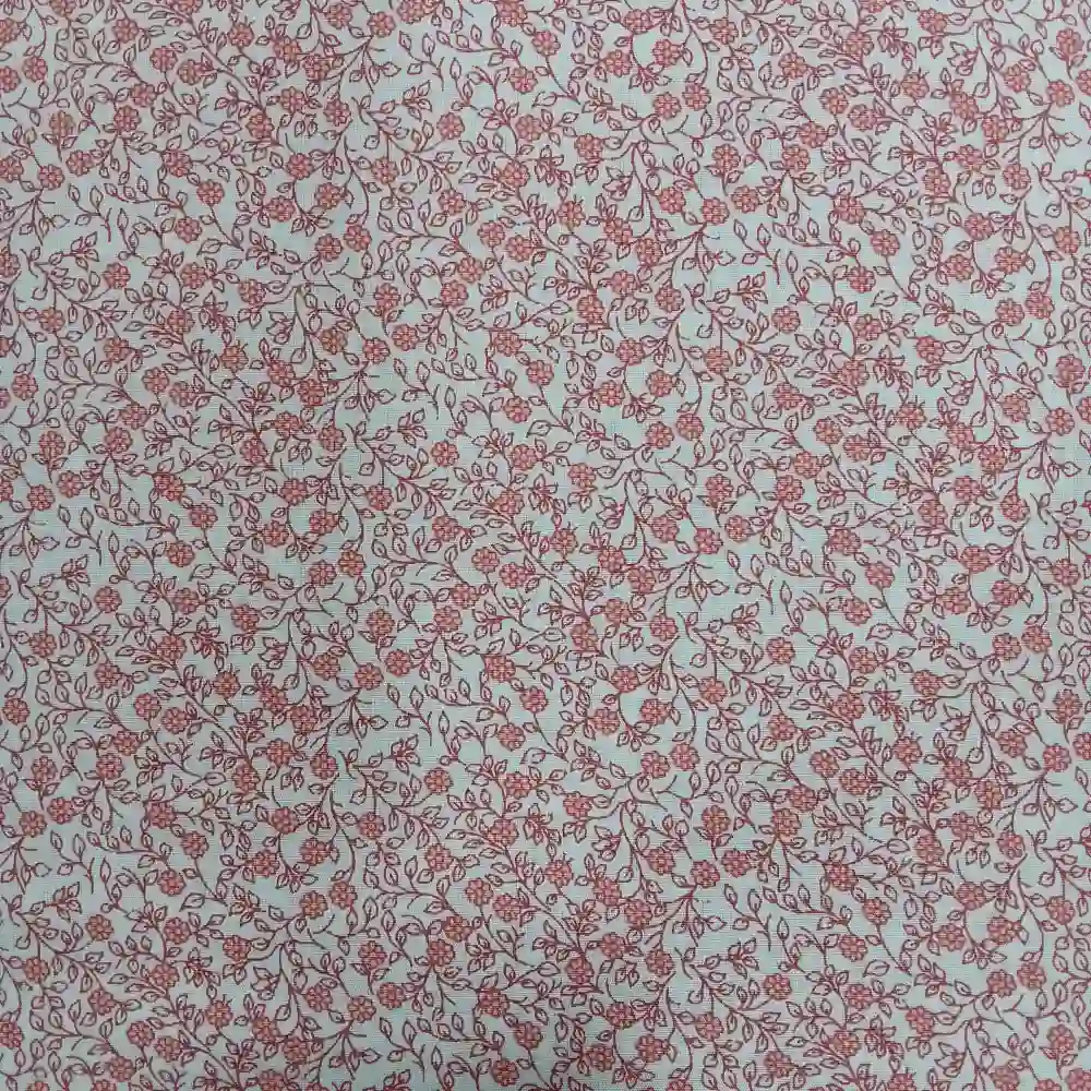 tela-algodon-estampada-flores-pequenas-rojas-1 Tela de algodón estampada con flores pequeñas rojas sobre fondo blanco, ideal para confección, patchwork y decoración.