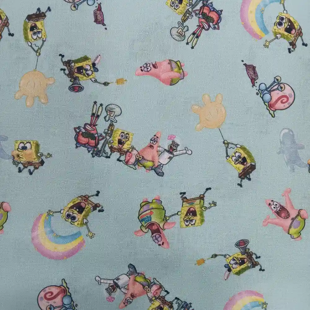Tela de algodón con licencia Bob Esponja, estampado infantil con personajes como Bob Esponja, Patricio y Gary sobre fondo azul.