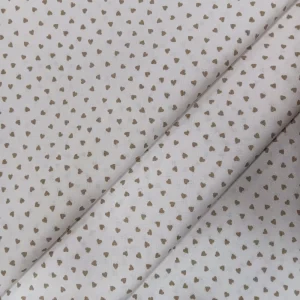 Tela de algodón blanco con estampado de pequeños corazones beige