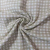 Muselina de algodón con estampado de cuadro vichy beige sobre fondo claro ideal para ropa infantil y costura creativa