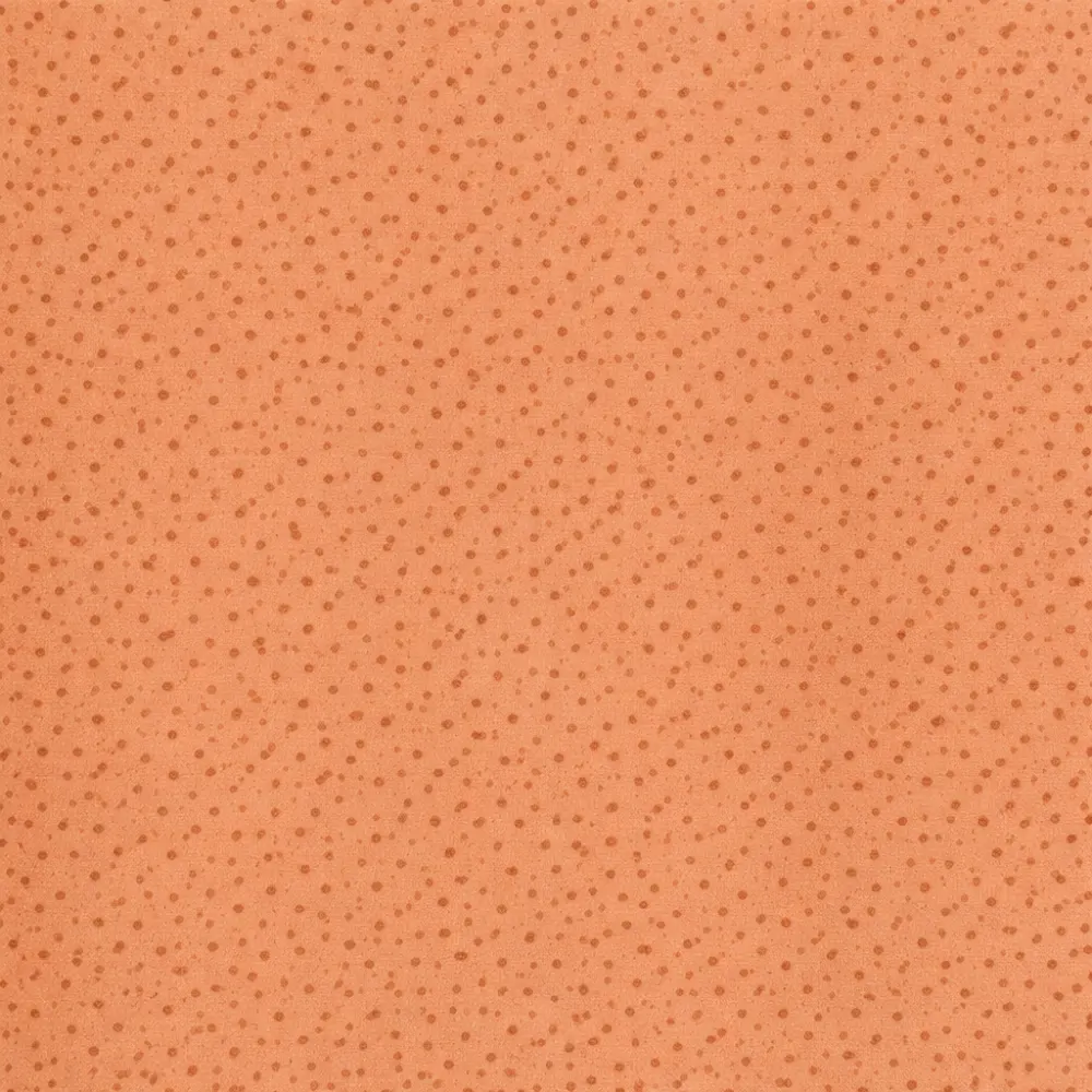 Tela de algodón naranja con estampado de pequeñas gotas