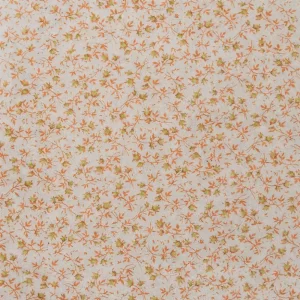 Tela de algodón rústico con estampado de flores pequeñas en tonos naranja y pistacho sobre fondo claro