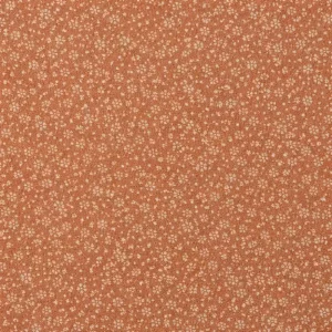 Tela de algodón rústico naranja con flores pequeñas y textura natural