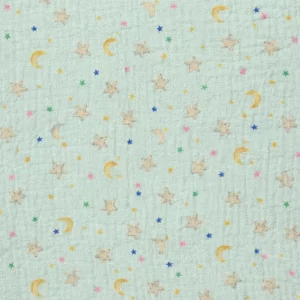 Tela de muselina de algodón verde menta con estampado de estrellas y lunas