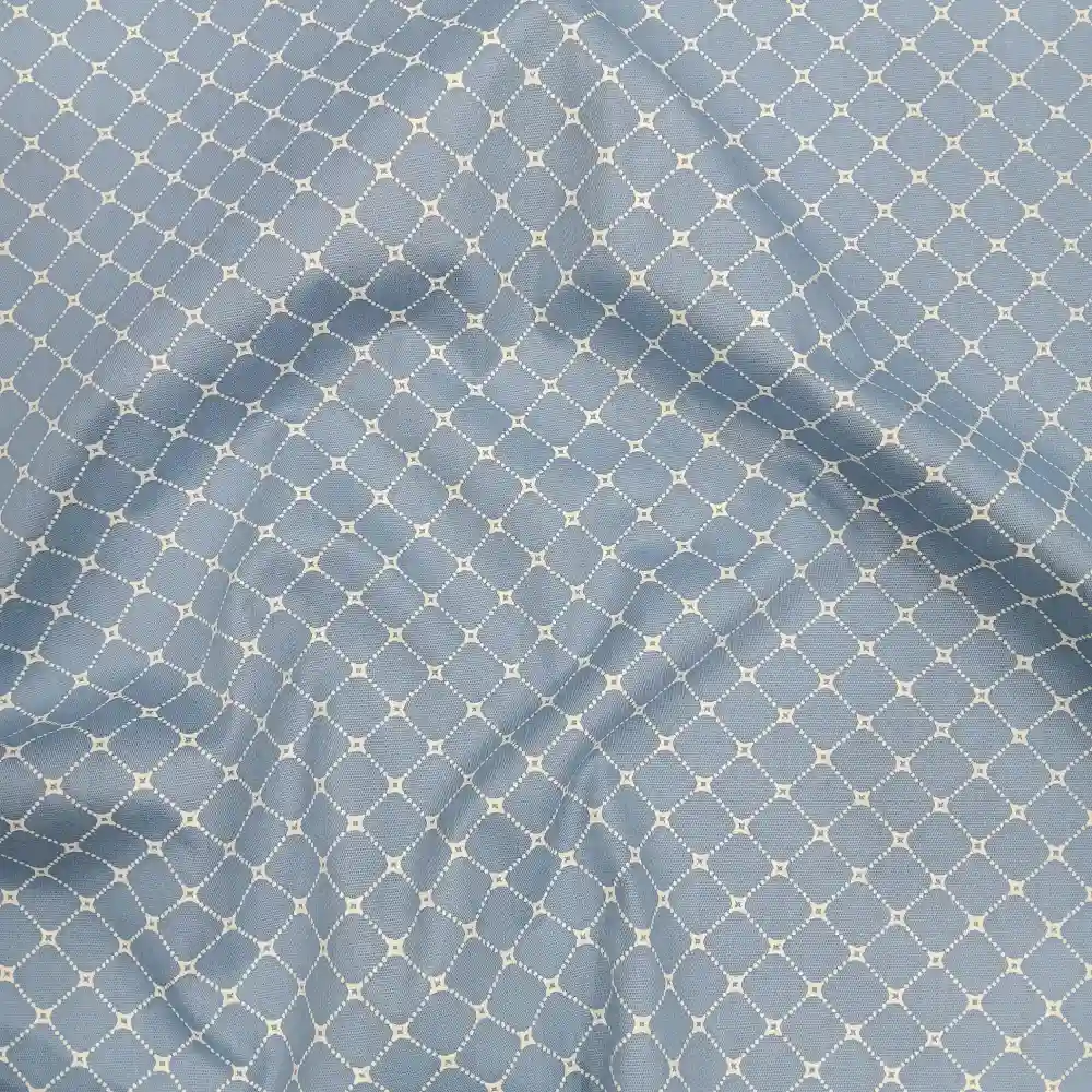 Tela de algodón azul con estampado de rombos blancos
