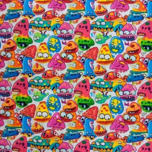 Tela de algodón estampado monstruos infantiles de colores vivos sobre fondo claro