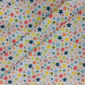 Tela algodón estampada de estrellas de colores sobre fondo claro para confección y patchwork
