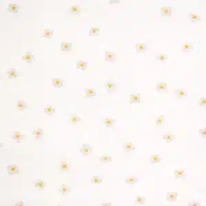 Tela de algodón flores beige con centro amarillo sobre fondo claro y estampado delicado.