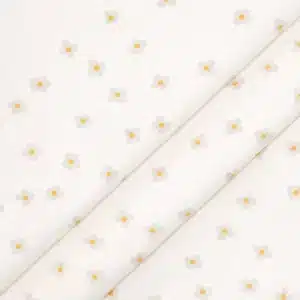 Tela de algodón flores beige con centro amarillo sobre fondo claro y estampado delicado.