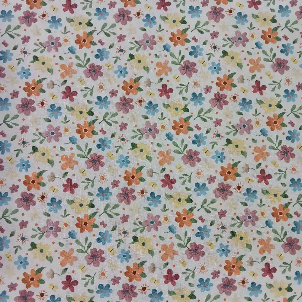 Tela de algodón con estampado de flores pequeñas de colores sobre fondo claro
