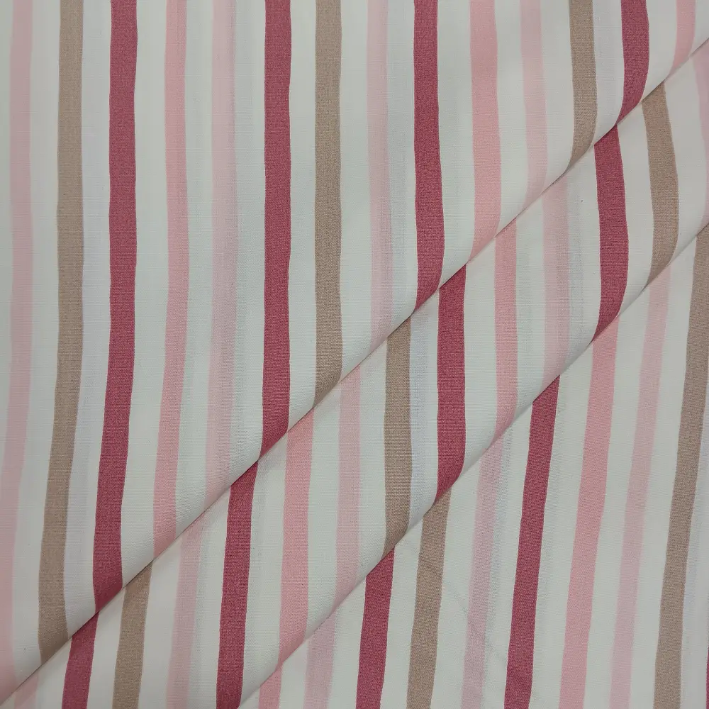 Tela de algodón con estampado de rayas verticales en tonos rosa, beige y blanco