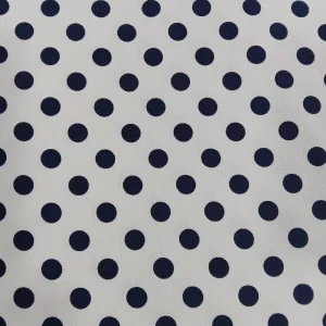 Tela piqué blanca con lunares azules en estampado clásico y textura gofrada