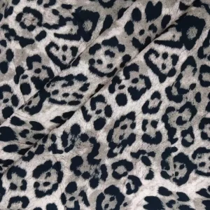 Tela de viscosa estampada Leopardo con diseño animal print en tonos neutros, ideal para confección de moda