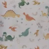 tela-algodon-estampada-dinosaurios-1 Tela de algodón estampada dinosaurios en tonos suaves sobre fondo claro, ideal para infantil