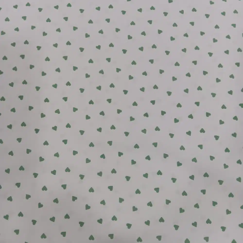 tela-algodon-blanca-estampada-corazones-blanco-1 Tela de algodón blanca estampada con pequeños corazones verde mint distribuidos de forma uniforme.