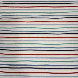 Tela de algodón con rayas horizontales dibujadas de aspecto irregular en tonos azul, verde, rojo y azul marino sobre fondo claro.