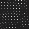 Tela de algodón estampada con pequeñas estrellas blancas sobre fondo negro.