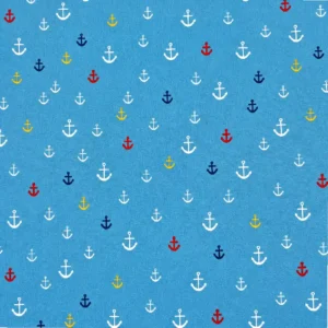 Tela de algodón azul con pequeñas anclas estampadas de diferentes tamaños en blanco, rojo, amarillo y azul marino, distribuidas por toda la superficie.